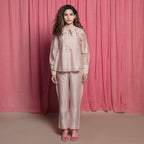 Front View of a Model wearing Champagne Cotton Chanderi Flared Tie Neck Top