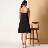 Back View of a Model wearing Charcoal Black Cotton Flax Strappy Slit Dress