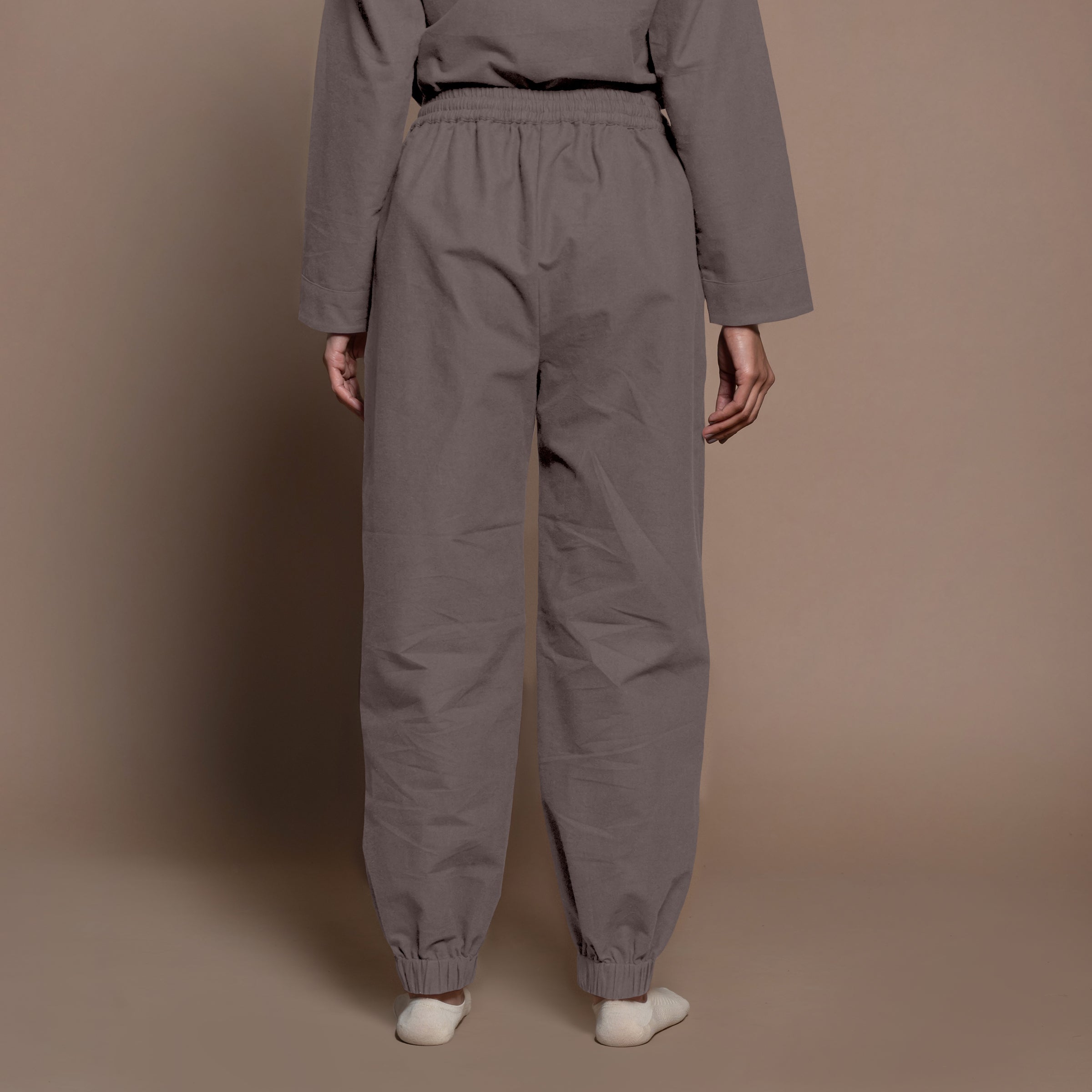 Back View of a Model wearing Charcoal Grey Warm Cotton Flannel Elasticated High-Rise Jogger Pant