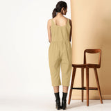 Back View of a Model wearing Light Khakhi Cotton Flax Button-Down Jumpsuit