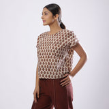 Left View of a Model wearing Beige Block Print Floral Loose Fit Top