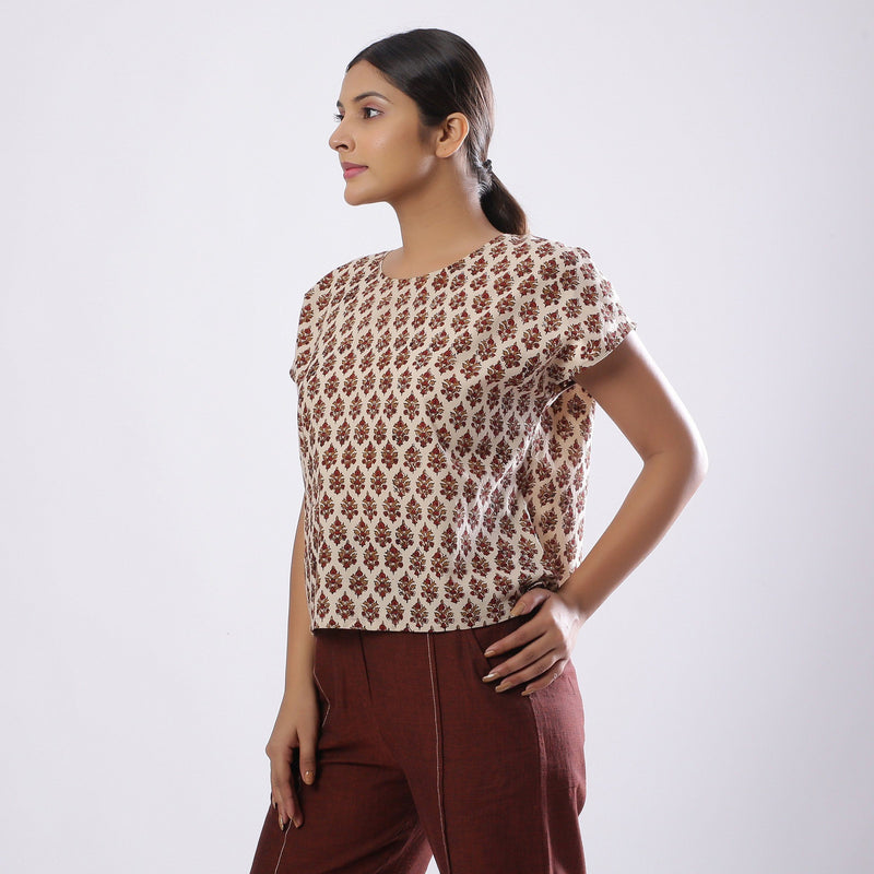 Left View of a Model wearing Beige Block Print Floral Loose Fit Top