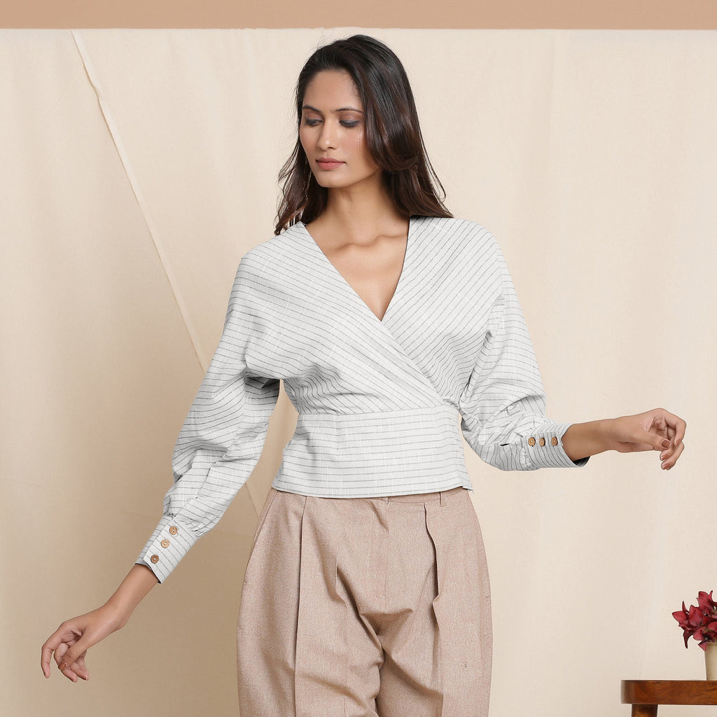 Front View of a Model wearing Cloudy Grey Striped Surplice Neck Blouson Top