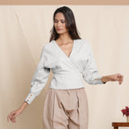 Front View of a Model wearing Cloudy Grey Striped Surplice Neck Blouson Top