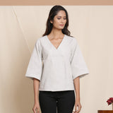 Front View of a Model wearing Cloudy Grey 100% Cotton Loose Fit V-Neck Top