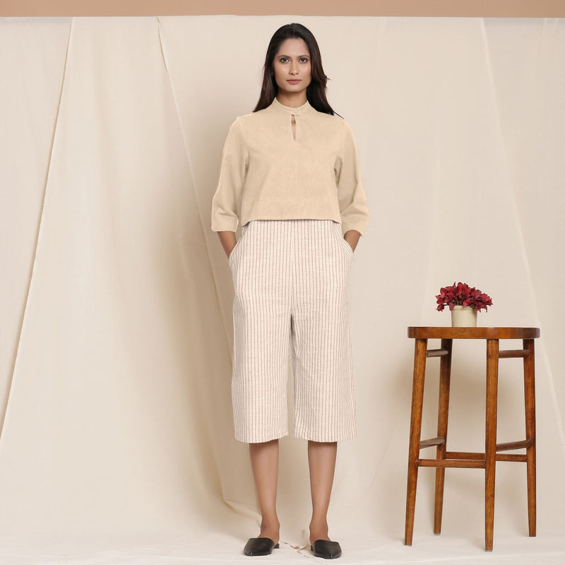 Front View of a Model wearing Beige Warm Cotton Flannel Knee Length Yoked Jumpsuit