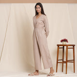 Left View of a Model wearing Dusk Brown Cotton Elasticated Surplice Neck Overalls Jumpsuit