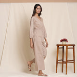 Right View of a Model wearing Dusk Brown Cotton Elasticated Surplice Neck Overalls Jumpsuit