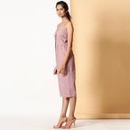 Left View of a Model wearing Comfy Cotton Sleeveless Button-Down Jumpsuit