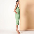 Right View of a Model wearing Green Cotton Sleeveless Button-Down Jumpsuit