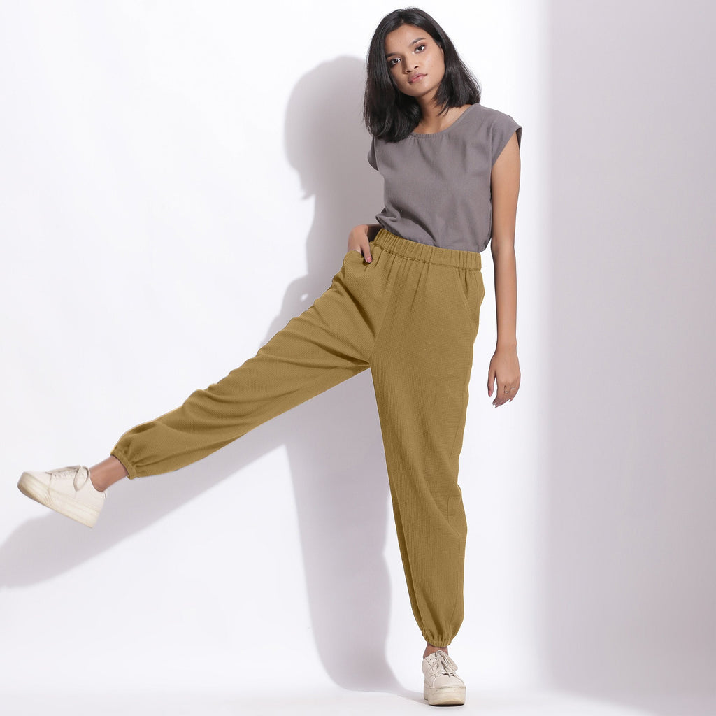 Front View of a Model wearing Comfy Olive Green Cotton Waffle Jogger Pants