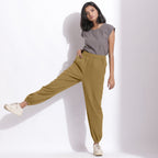 Front View of a Model wearing Comfy Olive Green Cotton Waffle Jogger Pants