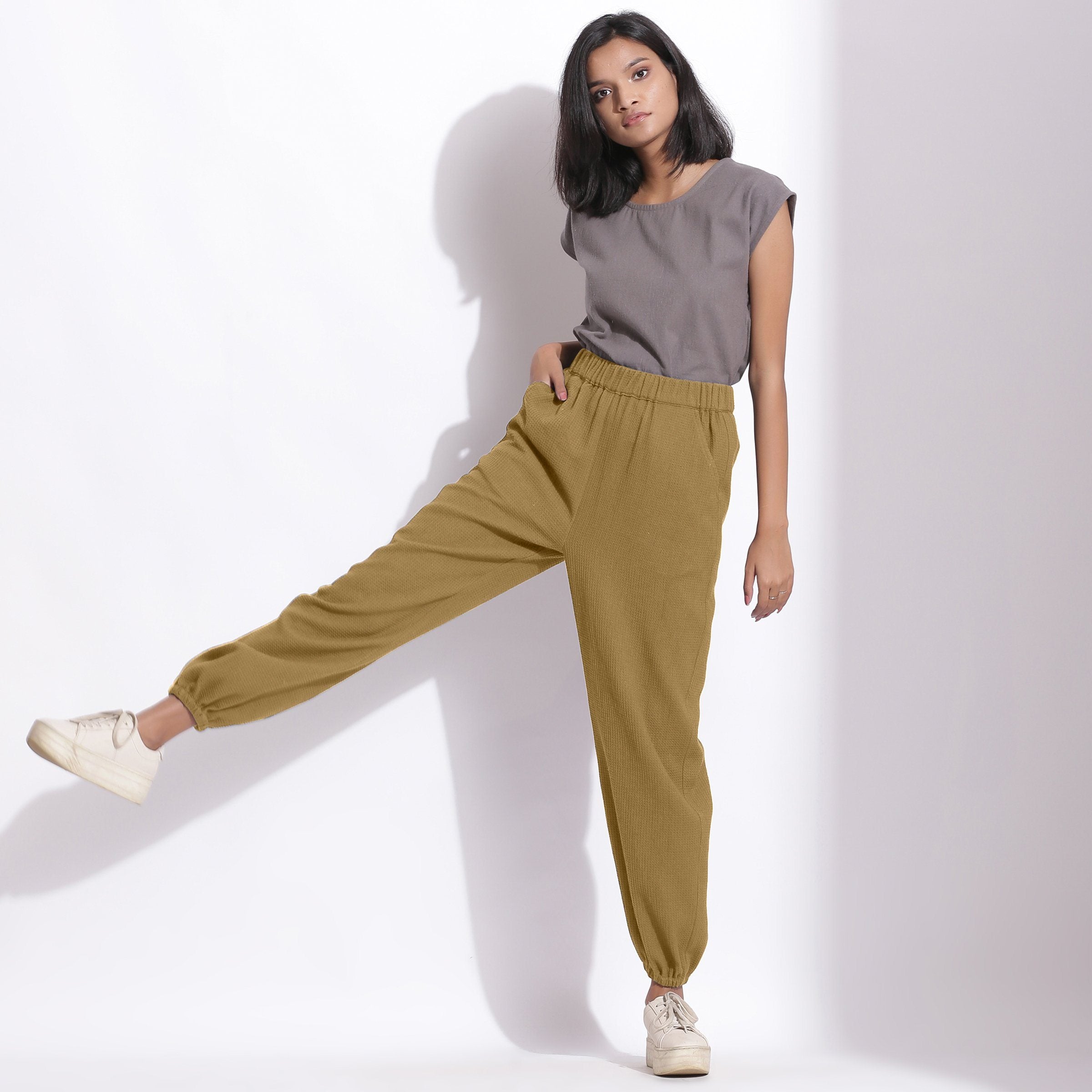 Front View of a Model wearing Comfy Olive Green Cotton Waffle Jogger Pants