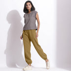 Left View of a Model wearing Comfy Olive Green Cotton Waffle Jogger Pants