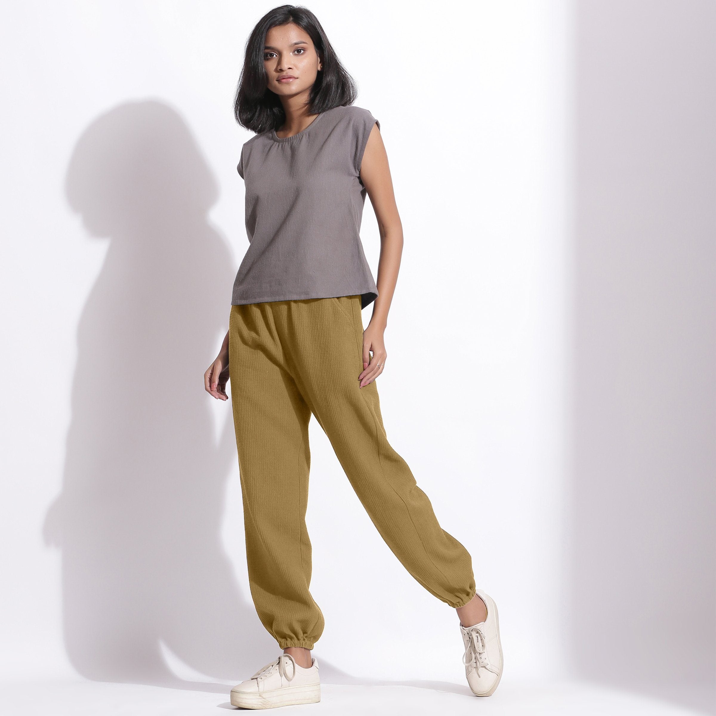 Left View of a Model wearing Comfy Olive Green Cotton Waffle Jogger Pants