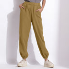 Front View of a Model wearing Comfy Olive Green Cotton Waffle Jogger Pants
