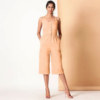 Front View of a Model wearing Yellow Cotton Sleeveless Button-Down Jumpsuit