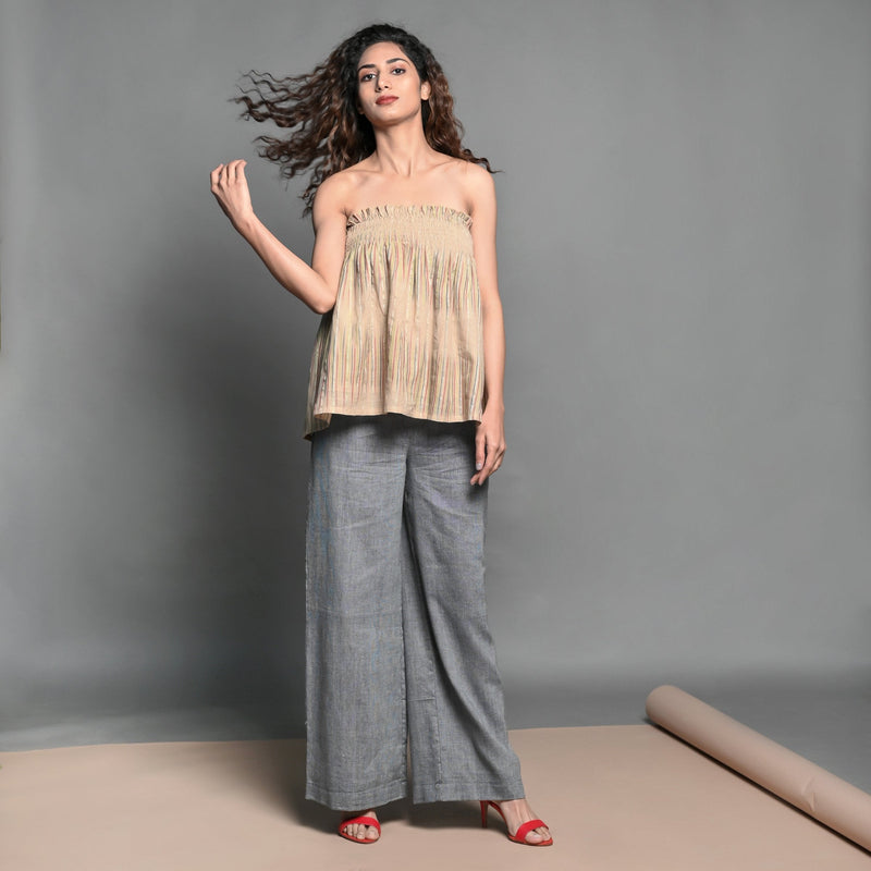 Front View of a Model wearing Convertible Beige Handwoven Cotton Elasticated Shirred Top Skirt