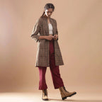 Right View of a Model wearing Convertible Warm Kalamkari Short Overlay Dress