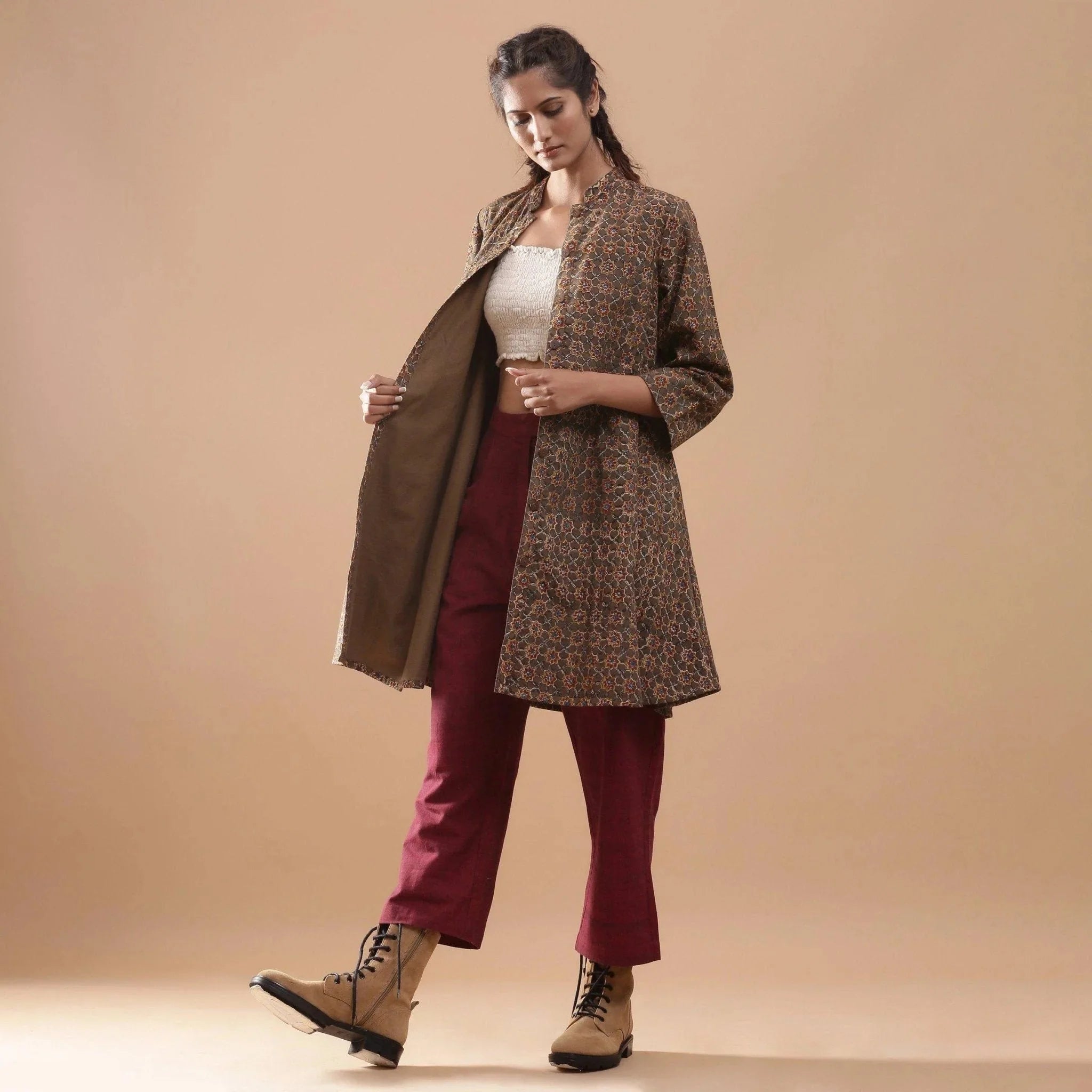 Front View of a Model wearing Convertible Warm Kalamkari Short Overlay Dress