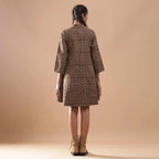 Back View of a Model wearing Convertible Warm Kalamkari Short Overlay Dress
