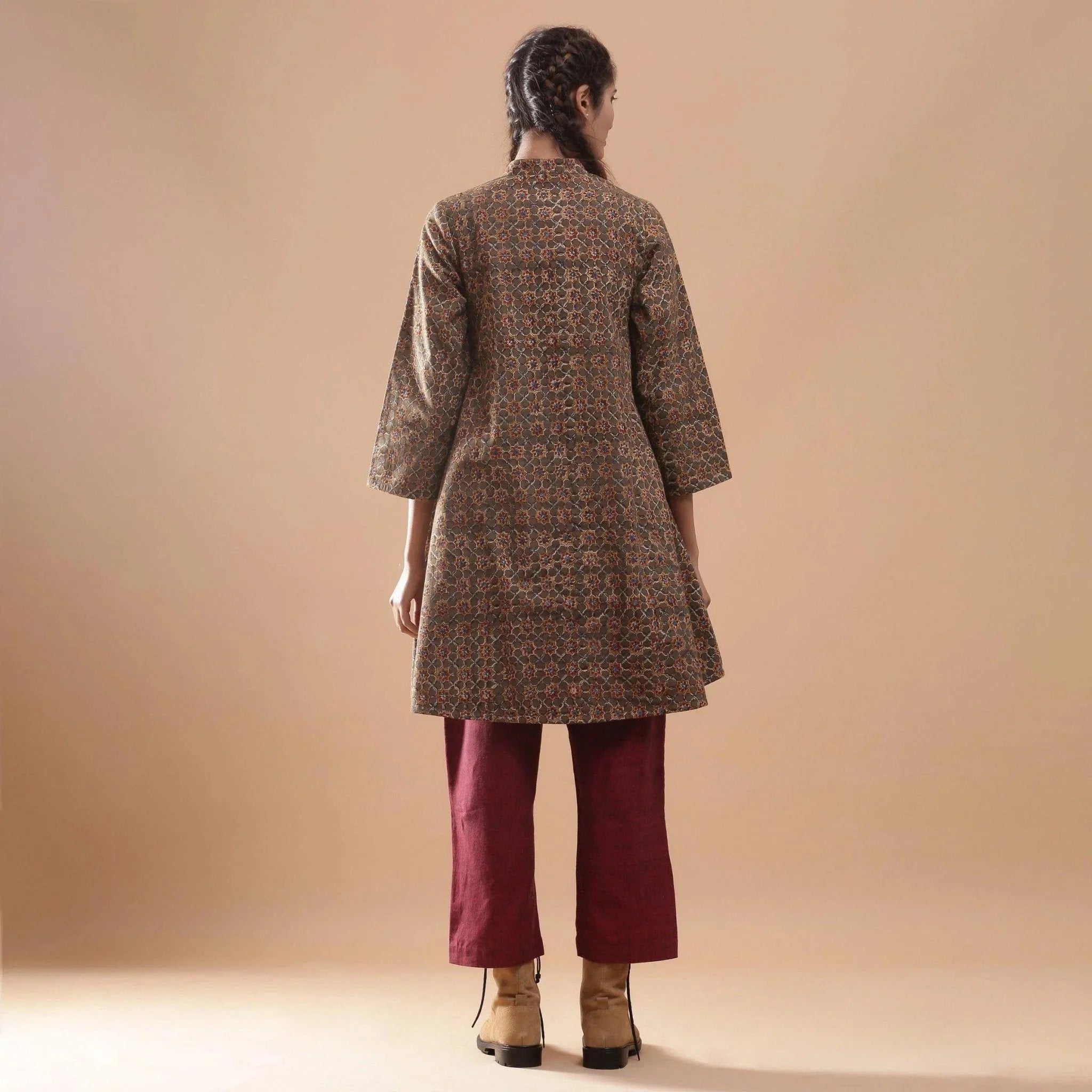 Back View of a Model wearing Convertible Warm Kalamkari Short Overlay Dress