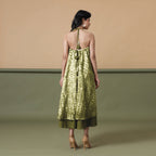 Back View of a Model wearing Convertible Olive Green Shibori Tie Dye 6-Way Skirt Dress