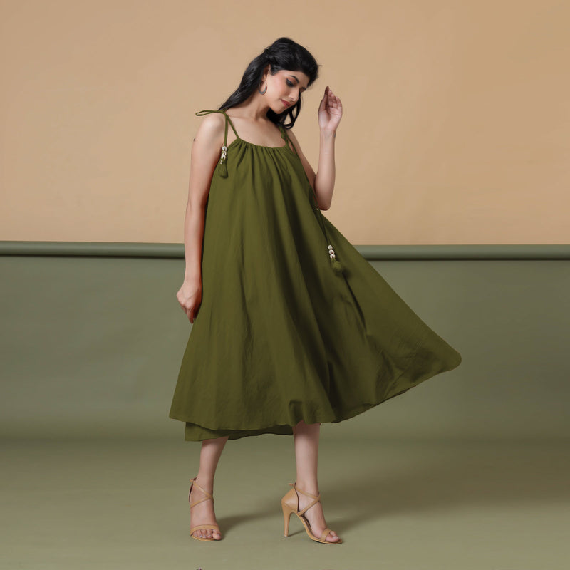 Right View of a Model wearing Convertible Olive Green Shibori Tie Dye 6-Way Skirt Dress