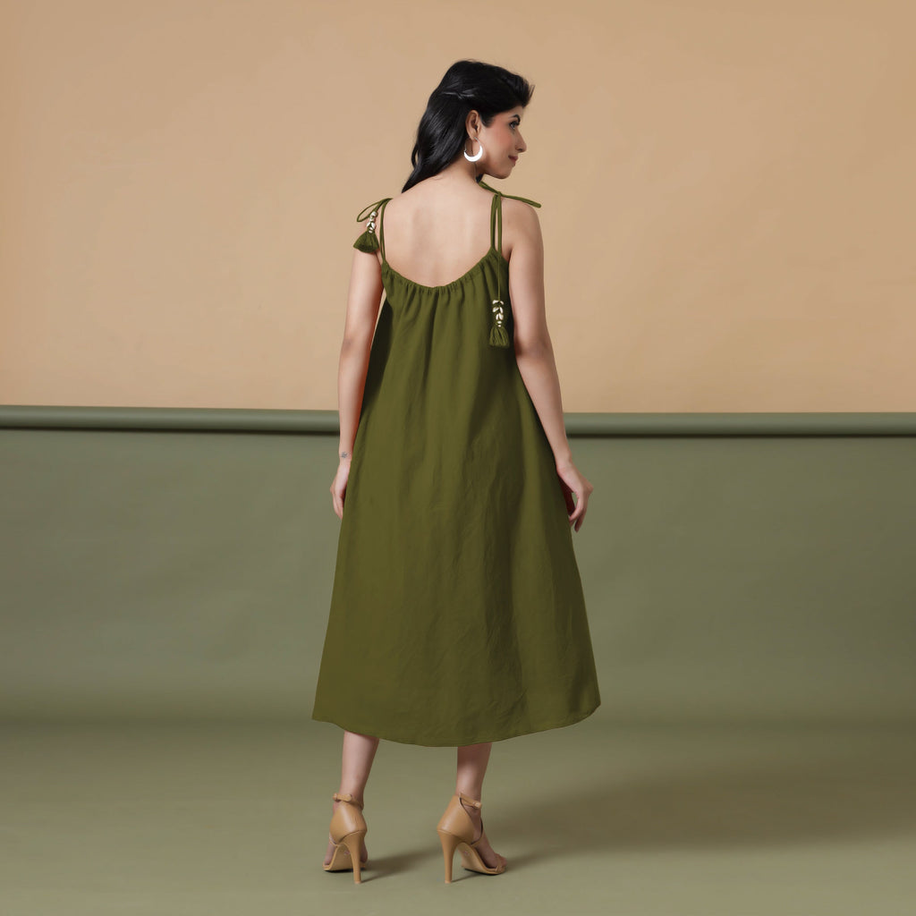 Back View of a Model wearing Convertible Olive Green Shibori Tie Dye 6-Way Skirt Dress