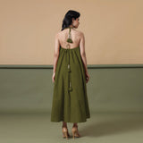 Back View of a Model wearing Convertible Olive Green Shibori Tie Dye 6-Way Skirt Dress
