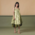 Right View of a Model wearing Convertible Olive Green Shibori Tie Dye 6-Way Skirt Dress