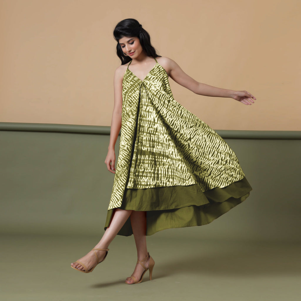 Left View of a Model wearing Convertible Olive Green Shibori Tie Dye 6-Way Skirt Dress