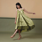 Left View of a Model wearing Convertible Olive Green Shibori Tie Dye 6-Way Skirt Dress