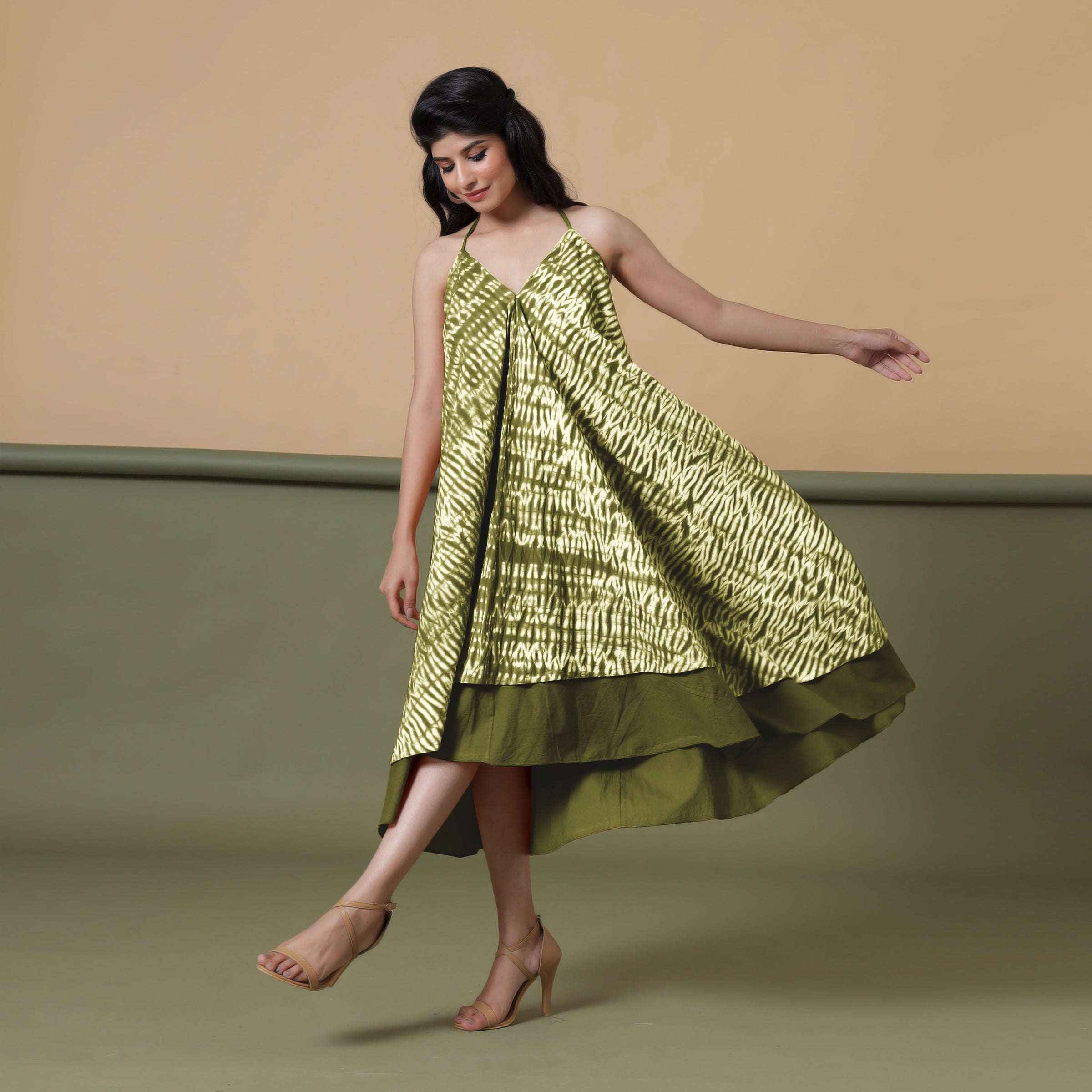 Left View of a Model wearing Convertible Olive Green Shibori Tie Dye 6-Way Skirt Dress