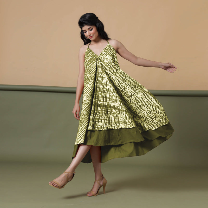 Left View of a Model wearing Convertible Olive Green Shibori Tie Dye 6-Way Skirt Dress
