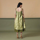 Back View of a Model wearing Convertible Olive Green Shibori Tie Dye 6-Way Skirt Dress