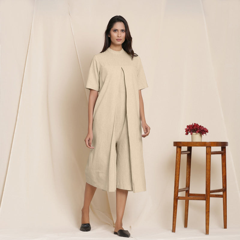 Right View of a Model wearing Cotton Beige Box Pleated Jumpsuit