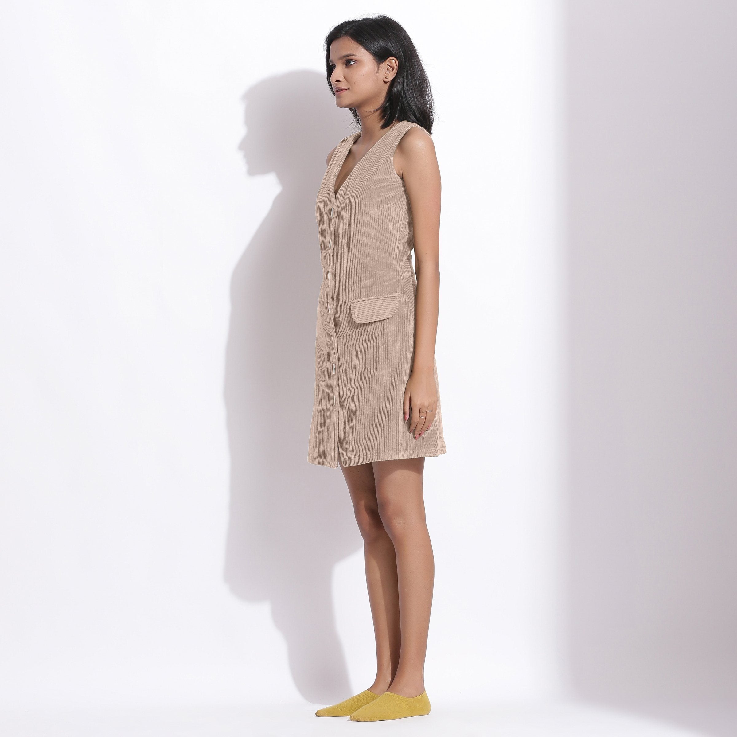 Left View of a Model wearing Cotton Corduroy Dusk Beige Button-Down Dress