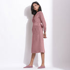 Left View of a Model wearing Cotton Corduroy Mauve Surplice Dress