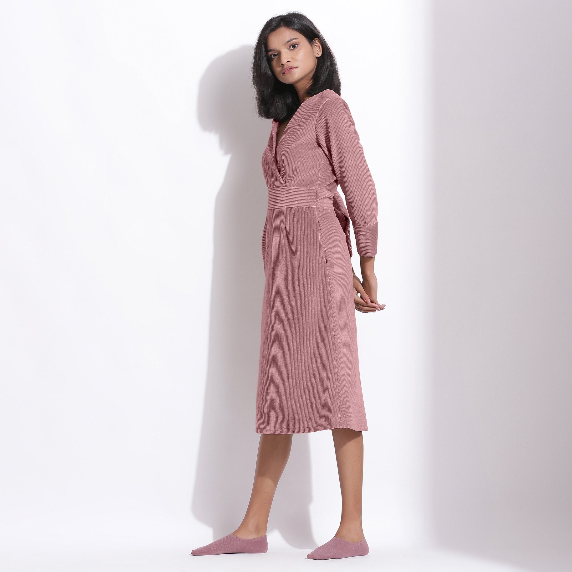 Left View of a Model wearing Cotton Corduroy Mauve Surplice Dress