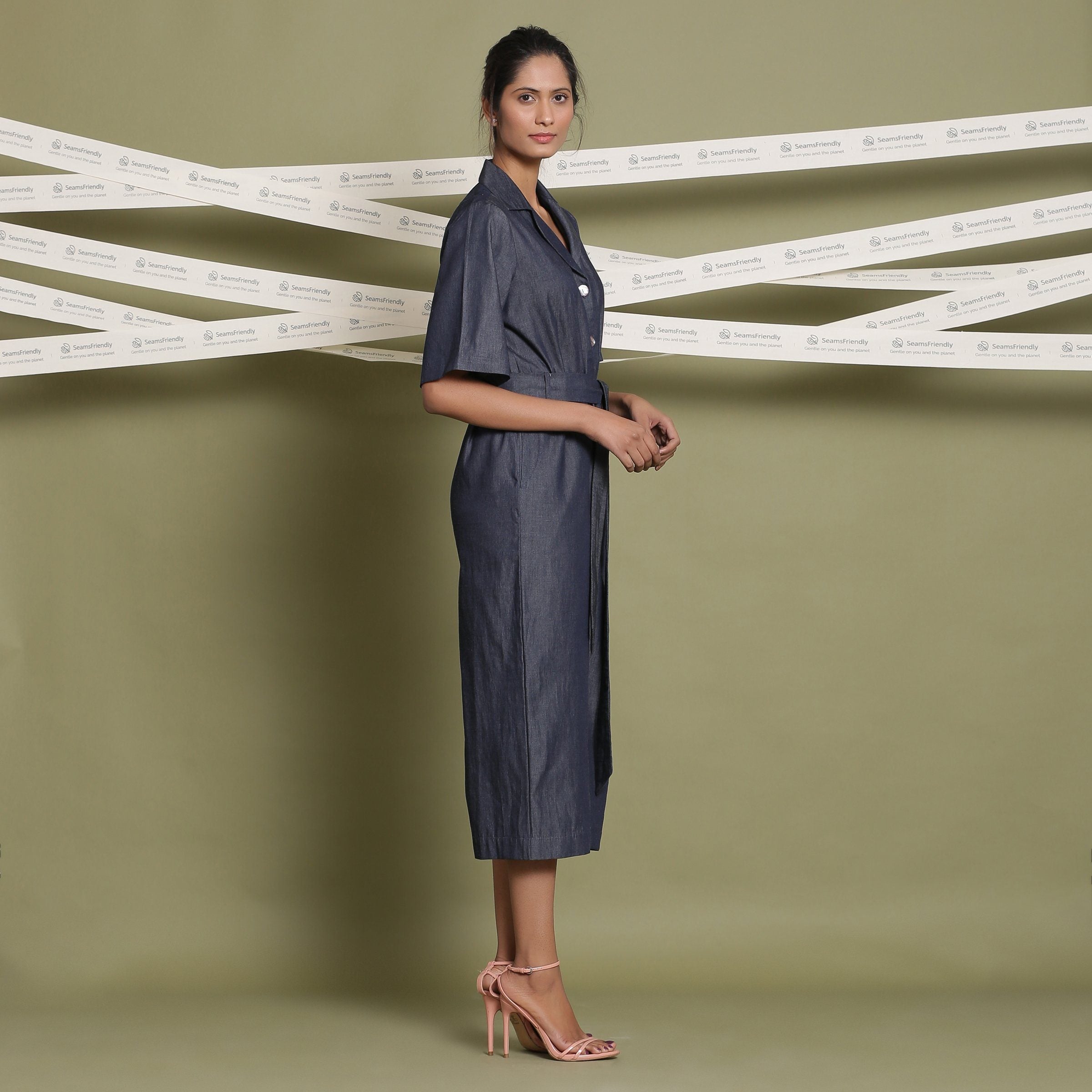 Right View of a Model wearing Cotton Denim Loose Fit Flared Jumpsuit