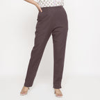 Front View of a Model wearing Cotton Flax Mid-Rise Brown Tapered Pant