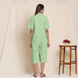 Back View of a Model wearing Cotton Green Box Pleated Jumpsuit