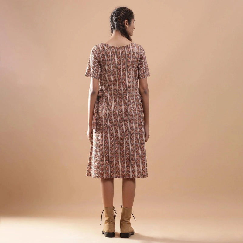 Back View of a Model wearing Kalamkari Chevron Striped Paneled Dress