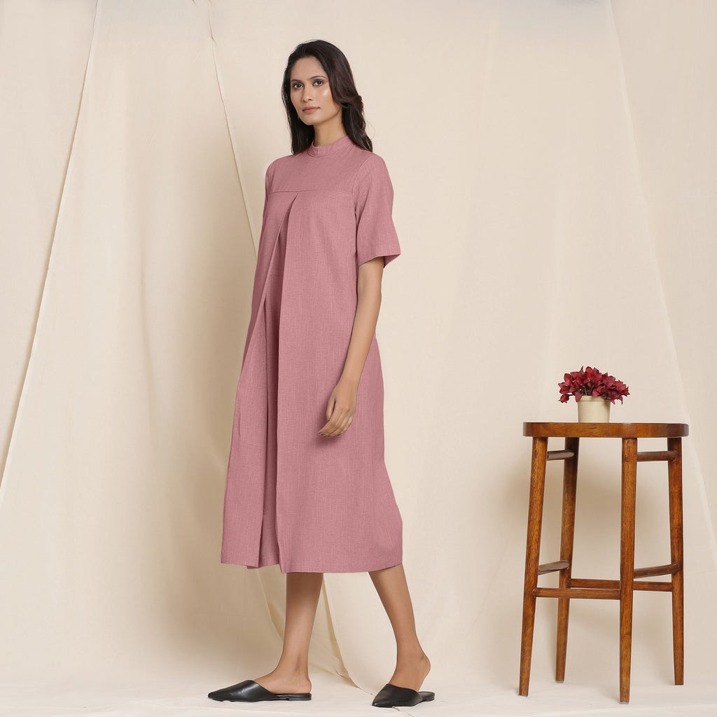 Left View of a Model wearing Cotton Maroon Box Pleated Jumpsuit