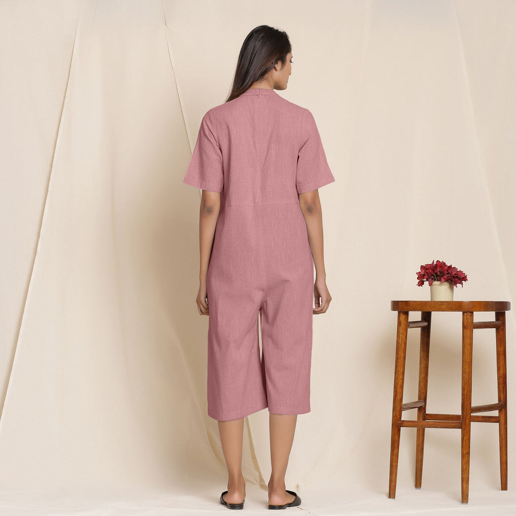 Back View of a Model wearing Cotton Maroon Box Pleated Jumpsuit