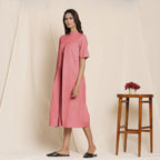 Left View of a Model wearing Cotton Red Box Pleated Jumpsuit