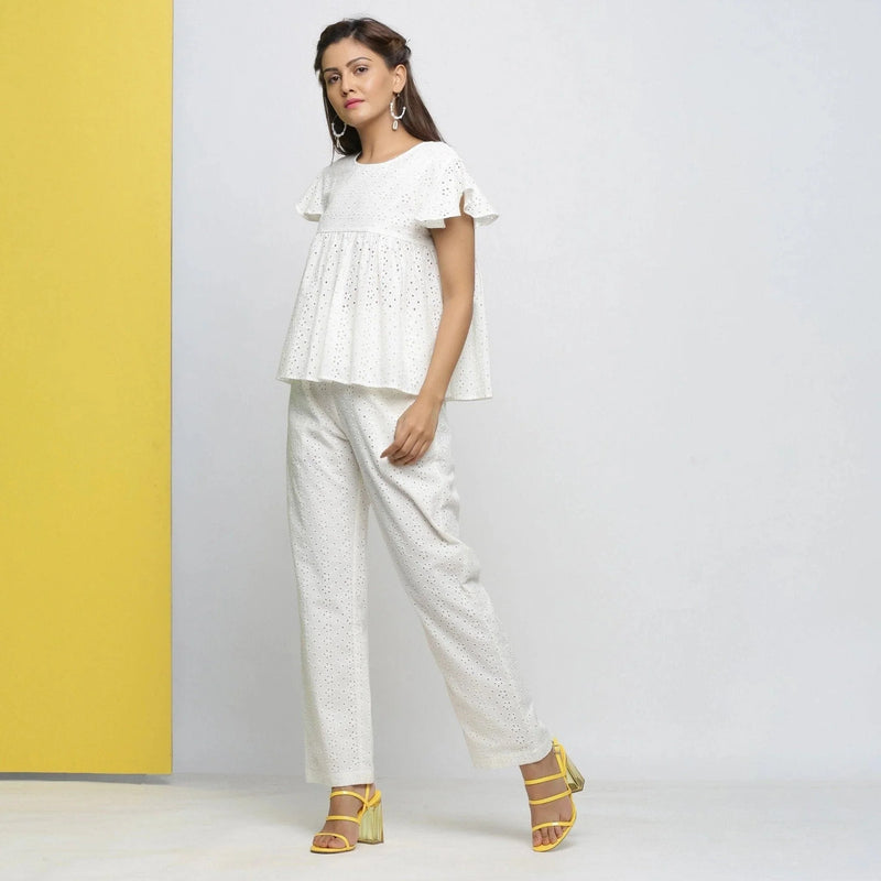 Left View of a Model wearing Cotton Schiffli White Straight Pant