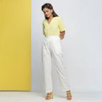 Front View of a Model wearing Cotton Schiffli White Straight Pant