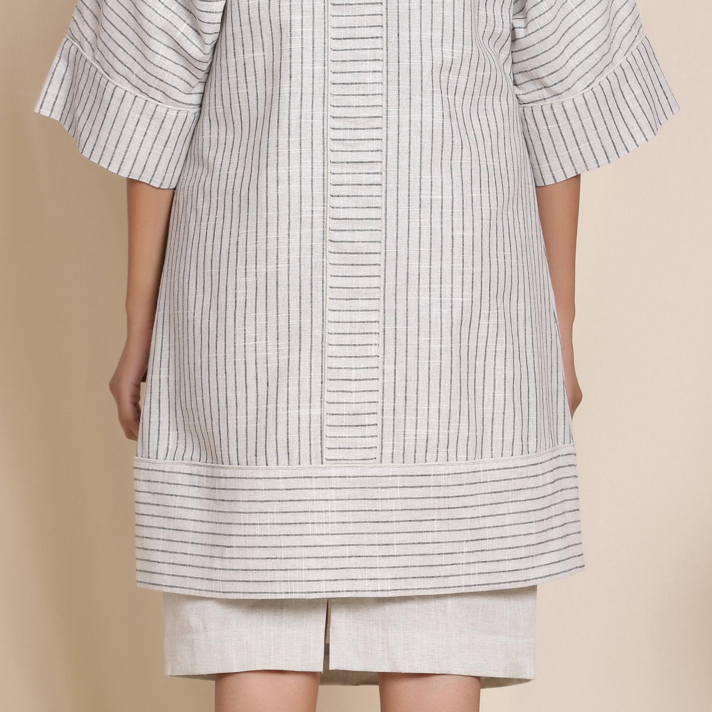 Back Detail of a Model wearing Grey Striped Cotton Front Open Paneled Overlay